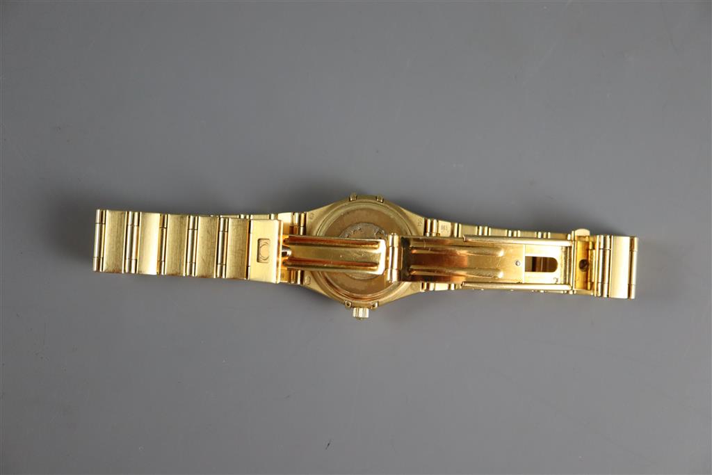 A ladys 1990s 18ct gold Omega Constellation quartz wrist watch with diamond set mother of pearl dial and bezel,